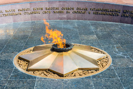 Bright eternal flame in memory of the memorial area in Tashkent, Uzbekistan.のeditorial素材