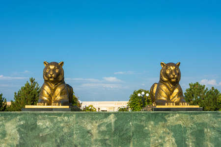 The statue of two tigers in Samarkand, on the blue sky background, Uzbekistan.の写真素材