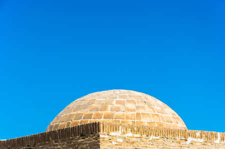 Ancient Muslim tombs on the background of blue sky in Bukhara.の写真素材