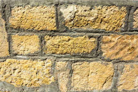 Beautiful texture old stone wall on a bright Sunny day.の写真素材