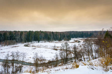 Beautiful Russian with a meandering small river landscape in early winter.の写真素材