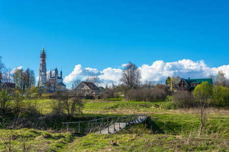 View of the village of Mikhailovskoye with views of the Church of the Holy Archangel Michael and the bodiless hosts on a Sunny spring day.の写真素材