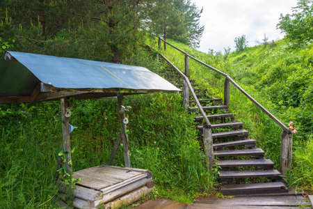 The well at the Holy spring in honor of the icon mother of God Joy of All who sorrow Sharinsky district, Kostroma region, Russia.の写真素材