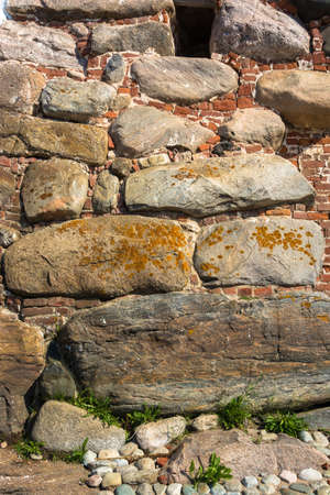 The texture of the stone walls of the Spaso-Preobrazhensky Solovetsky monastery, Arkhangelsk oblast, Russia.の写真素材