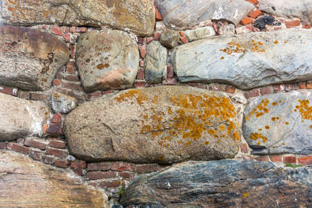 The texture of the stone walls of the Spaso-Preobrazhensky Solovetsky monastery, Arkhangelsk oblast, Russia.の写真素材