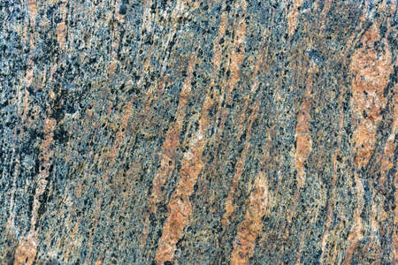 Bright red-and-blue texture large multi color stone in the sunlight.の写真素材