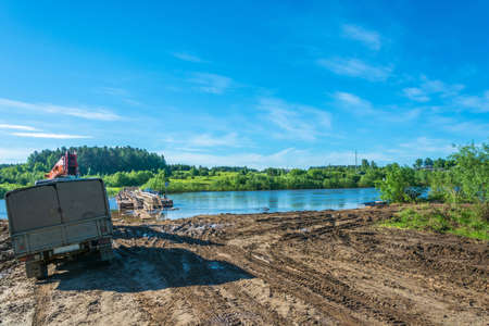 Ferry on the river Vetluga at the village Mihajlovicha on a Sunny summer day, Kostroma oblast, Russia.の写真素材