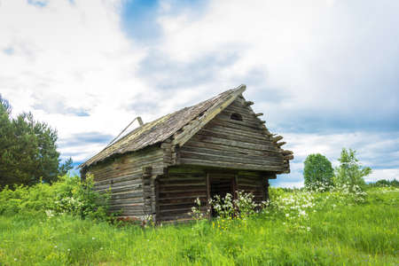 The crumbling barn in the defunct village Burdovo, Kostroma oblast, Russia.の写真素材