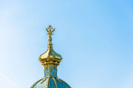 Beautiful Golden domes of the Church in Peterhof on the background of blue sky.のeditorial素材