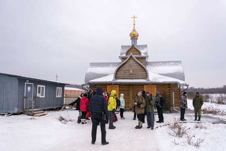 Village of Dunilovo, Ivanovo region, Russia - 01/20/2018: People are standing in a bath at the Epiphany on January 20, 2018 in the village of Dunilovo, Ivanovo region, Russia.のeditorial素材