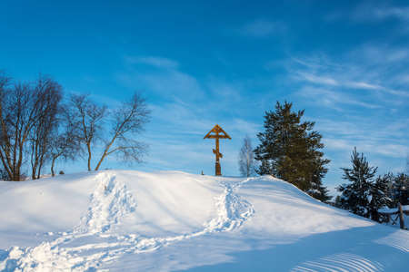 Poklonniy cross on Holy Irinarkhovo spring in a sunny winter day near the village of Khaurovo, Borisoglebsky district, Yaroslavl region, Russia.の写真素材
