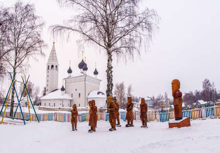 A composition of a wooden sculpture on a winter day in the village of Vyatskoe, Yaroslavl Region, Russia.のeditorial素材