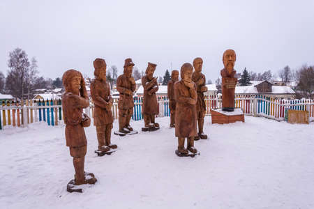 A composition of a wooden sculpture on a winter day in the village of Vyatskoe, Yaroslavl Region, Russia.の写真素材