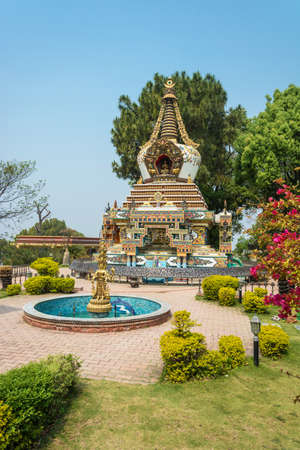 Stupa and the fountain in the Park of the Buddhist Kopan monastery, Kathmandu, Nepal.のeditorial素材