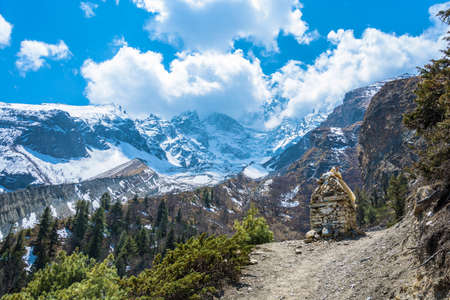 Beautiful landscape with stone stupa standing on a mountain path in Nepal.の写真素材