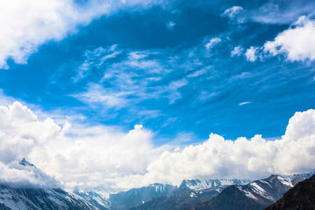 Snowy mountain peaks and white clouds in the Himalayas, Nepal.の写真素材