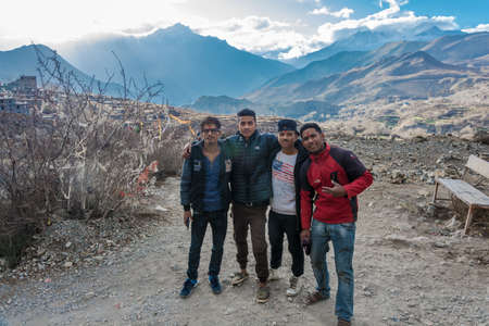 Muktinath, Nepal-07.04.2018: Four young nepalica against a mountain landscape 7 April 2018 in the...