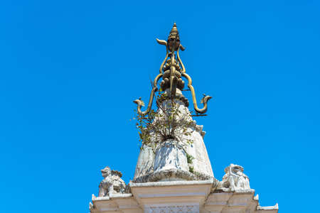 Original decoration on top of Buddhist temple on blue sky background, Nepal.のeditorial素材