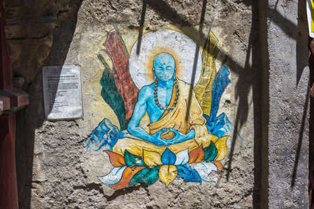 Kathmandu, Nepal â€“ 13.04.2018: figure of Buddha on the wall in the Pashupatinath Temple 13...