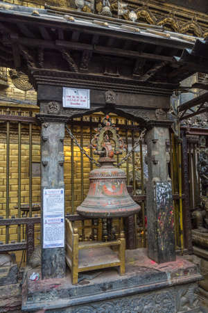 Kathmandu, Nepal-13/04/2018: Large metal bell in an ancient Buddhist temple on 13 April 2018 Kathmandu, Nepal.のeditorial素材