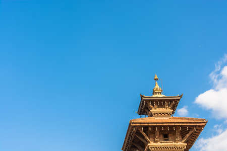 Original decoration on top of Buddhist temple on blue sky background, Nepal.の写真素材