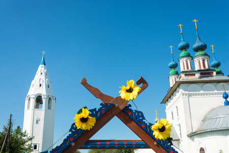 Luh, Ivanovo region, Russia - 08/25/2018: Three bright sunflowers on the top of the trading place at...