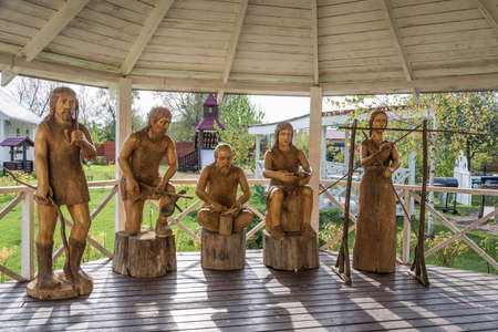 Vyatkoye village, Yaroslavl region, Russia - 02/10/2018: Primitive sculptures of primitive people on October 2, 2018, village Vyatkoye, Yaroslavl region, Russia.のeditorial素材