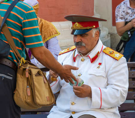 Moscow, Russia - 06/22/2019: A man like Joseph Stalin on Nikolskaya Street.