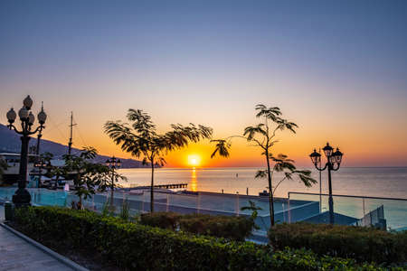 Beautiful sunrise over the calm Black Sea in Yalta, Crimea.の写真素材