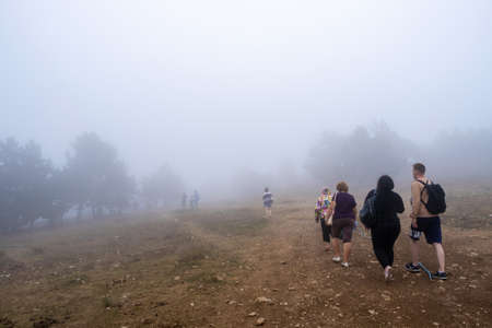 Miskhor, Crimea - 06/09/2019: Tourists on Ai-Petri at the upper station of the cableway Miskhor - Ai-Petri in heavy fog.のeditorial素材