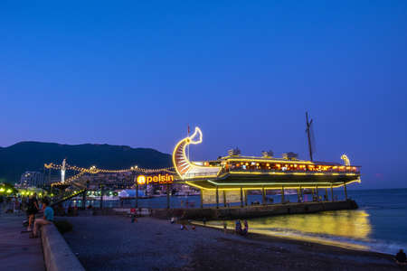 Yalta, Crimea - 09/06/2019: Evening on the embankment.の写真素材