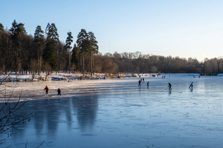 Ice skating on the first ice on the Talka river in Ivanovo, Russia.の写真素材