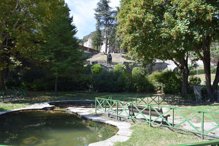 A garden with the statue of Cesare Augusto in Susa in the province of Turinの写真素材