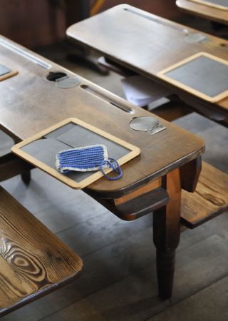 Old schoolroom desk and slateの写真素材
