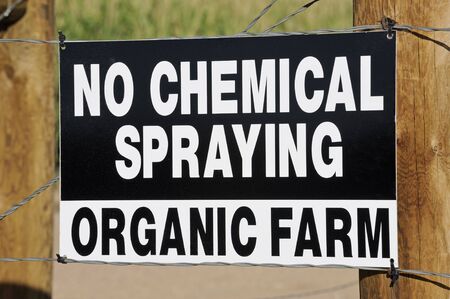 No spraying sign outside field on an organic farmの写真素材