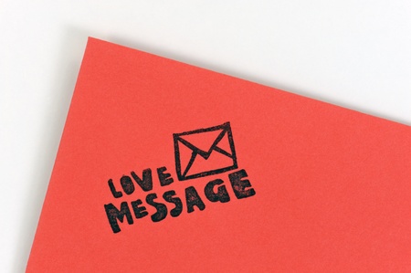 Red love letter with words love message on white の写真素材