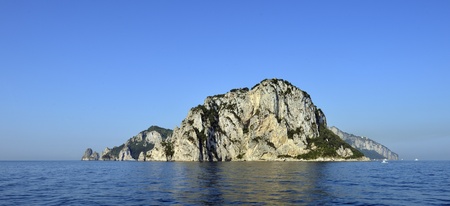 The island of capri from calm ocean, Italyの写真素材