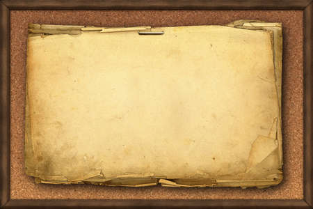 Yellowed pages of old paper on kork memo board の写真素材
