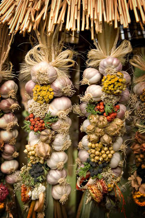 Fresh organic garlic braids at the local market の写真素材