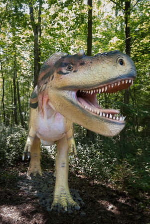 Sculpture of dinosaur tyrannosaur in live sizeの写真素材