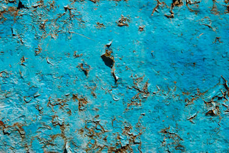Closeup of rusted metal surface with peeling paint.の写真素材