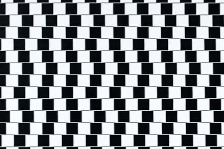 Lines are parallel but seem to be slanted - optical illusion.の写真素材