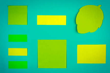 Colorful post it notes for messages on green background.の写真素材
