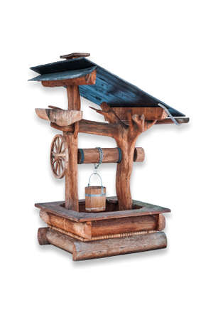 Rural wooden water well isolated on white. Path included.の写真素材