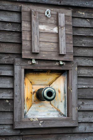 Pirate ship cannon window on old galleon.