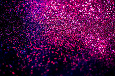 Pink/blue shiny glitter on black background. Macro shot, shalow DOF.の写真素材