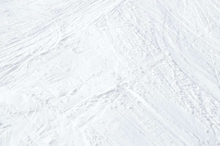 Top view of white ski tracks on snow background.の写真素材