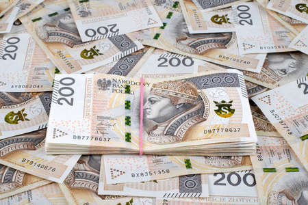 Background made of polish 200 zloty banknotes with bundle in the middle. Financial texture abstract.の写真素材