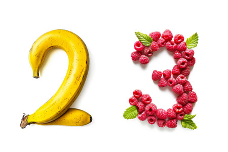 Fruits Number "2" and "3" Made of Bananas and RaspBerries Isolated on White Backgroundの素材