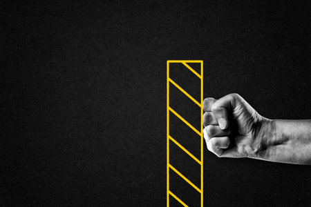 Hand Giving Fist Bump in Wall Symbol Gesture Sign in Black and White on Textured Paper Background, Copy Spaceの写真素材